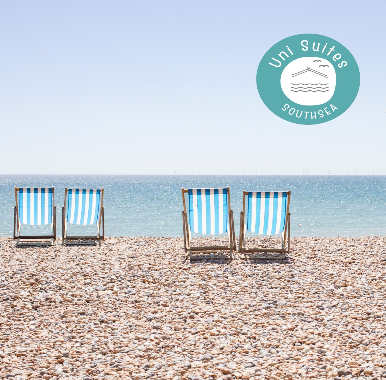 beach with chairs and company logo